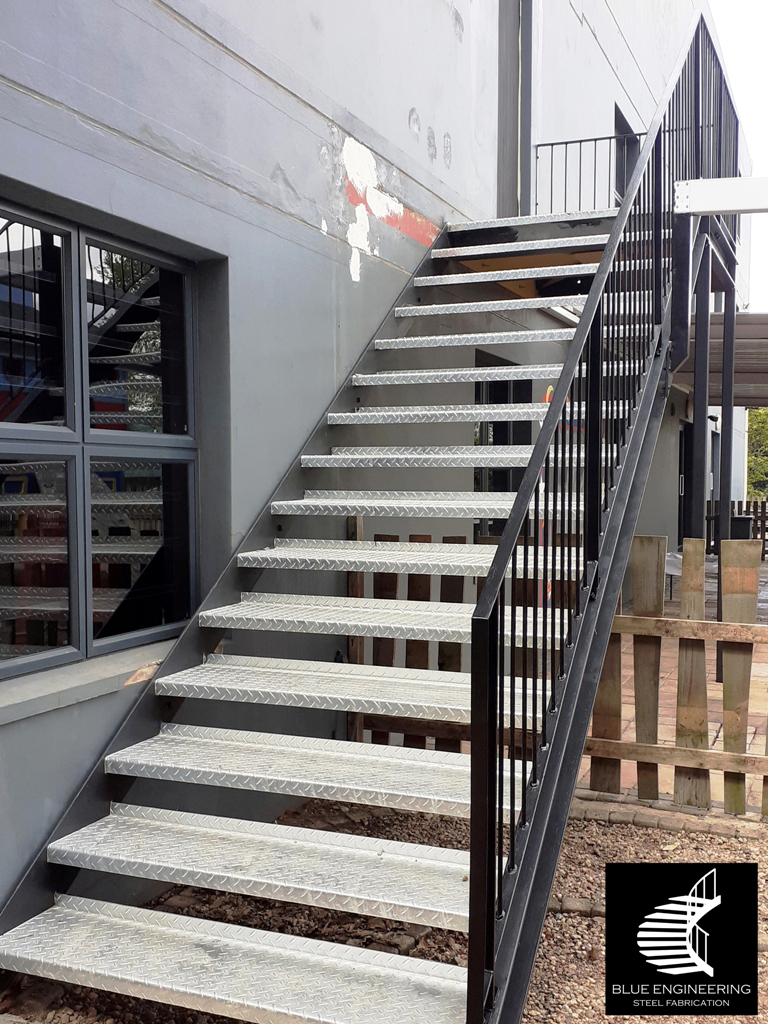 Commercial Steel Staircase with channel  stringer and checker plate treads. Gauteng, Johannesburg, Pretoria, KwaZulu Natal, Durban, Western Cape, Cape Town, South Arica