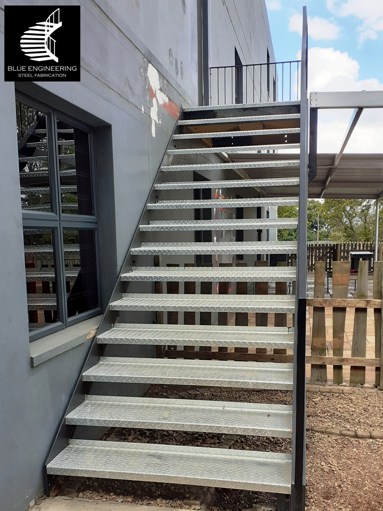 Commercial Steel Staircase with channel  stringer and checker plate treads. Gauteng, Johannesburg, Pretoria, KwaZulu Natal, Durban, Western Cape, Cape Town, South Arica