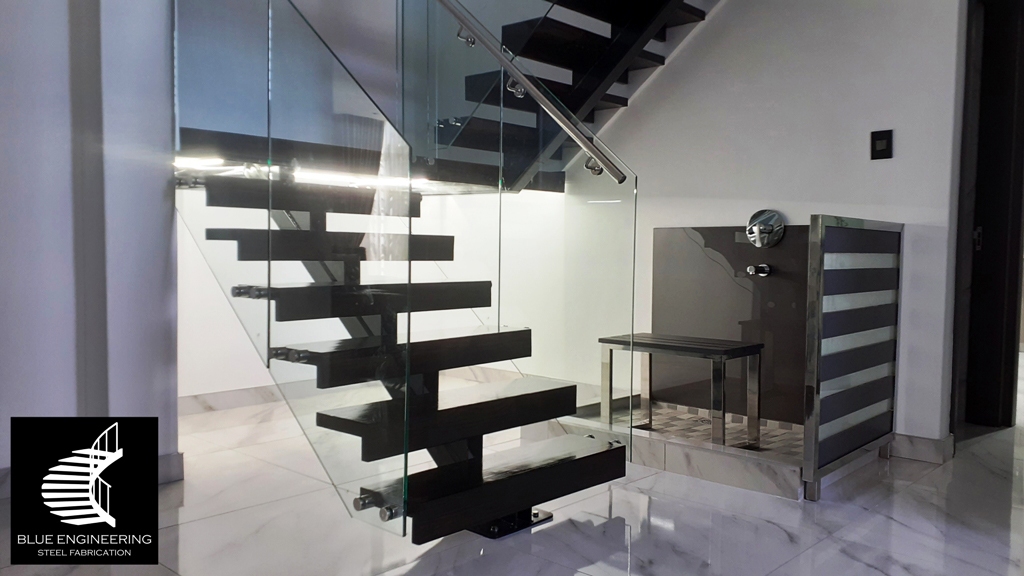 Mono Stringer Staircase with Glass Balustrades, Timber Treads and Stainless Steel Handrails. Gauteng, Johannesburg, Pretoria, Midrand, KwaZulu Natal, Durban, Ballito, South Africa