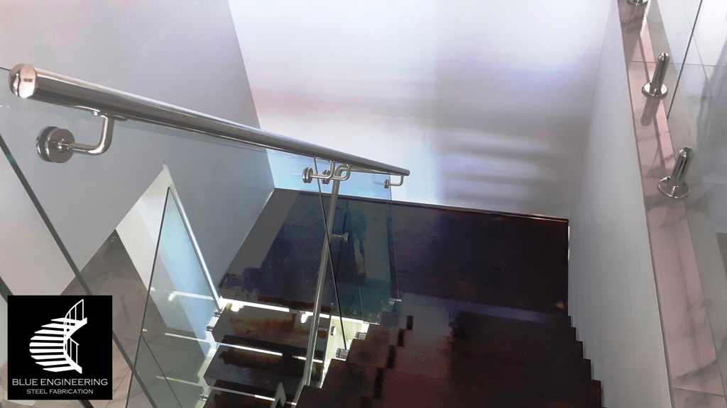 Mono Stringer Staircase with Glass Balustrades, Timber Treads and Stainless Steel Handrails. Gauteng, Johannesburg, Pretoria, Midrand, KwaZulu Natal, Durban, Ballito, South Africa