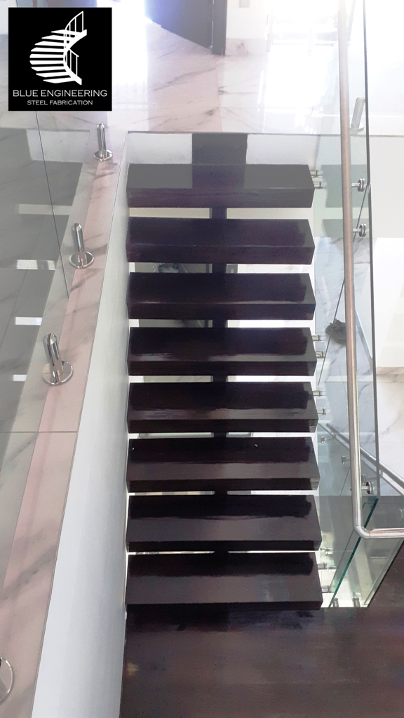 Mono Stringer Staircase with Glass Balustrades, Timber Treads and Stainless Steel Handrails. Gauteng, Johannesburg, Pretoria, Midrand, KwaZulu Natal, Durban, Ballito, South Africa