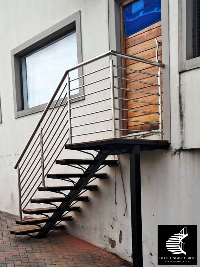 Mono Stringer Staircase with Balau Slat Timber Treads and Stainless Steel Balustreades. Blue Engineering supplies to Gauteng, Johannesburg, Pretoria, KwaZulu Natal, Durban, Western Cape, Capetown, South Africa